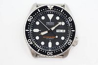 Front view showing dial, bezel, day-date window