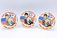 Front view of three buttons showing design and year details