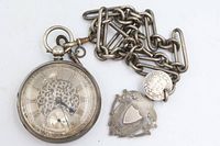 Pocket watch with attached chain, coin charm and separate shield fob