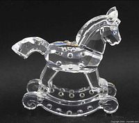 Left-side view of faceted clear crystal rocking horse figurine