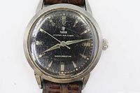 Front view showing dial, brand, model, dial texture and overall condition