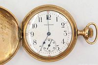 Open watch showing dial, hands, case rim