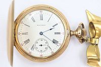 Open double hunter pocket watch showing dial, bow, crown and front cover