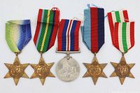 Front view of all five medals showing obverse designs and ribbons