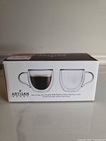 Front of retail box showing cup images and branding