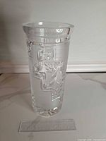 Full view of vase front, shows overall form and cut pattern