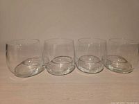 Front view of all four stemless glasses