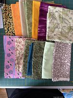 All twelve fabric pieces laid out on cutting mat