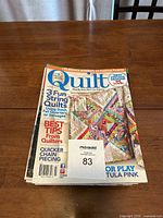 Stack of quilting magazines topped by an issue of Quilt magazine