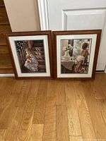 Both framed prints side by side on floor
