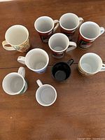 Group shot of all ten mugs on table