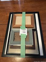 Stack of six assorted single-opening frames taped together