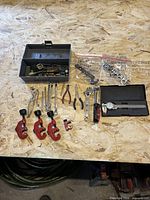 Full layout of all tools including caliper, tubing cutters, screwdrivers, wrenches, pliers, crowfoot set and soldering parts box
