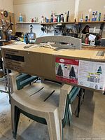 Sealed box containing 6.5 ft Paxton Pine pre-lit tree