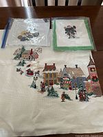 close view of village panel with two zipper bags holding Frozen pieces
