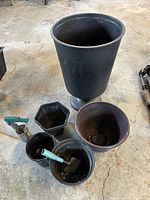group of urn planter, assorted pots and tools
