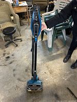 Full view of Shark DuoClean stick vacuum standing upright