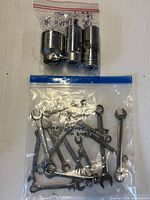 Bag of assorted wrenches and bag of deep sockets