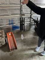 Full view of wind chime hanging, shows tubes, striker, sail