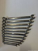 Full view of 12 Professional Series combination wrenches arranged largest to smallest