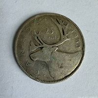 Reverse of 1950 Canada 25-cent coin showing caribou design