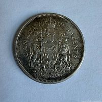 Reverse side showing Canadian coat of arms and date 1964