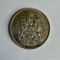 Reverse of 1966 Canadian 50 cent coin showing coat of arms