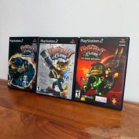 Front view of all three PS2 game cases