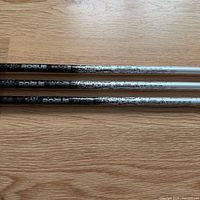 Three Rogue shafts showing graphics and carbon pattern