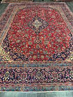 Full view of rug showing entire field, border and medallion