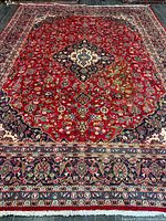 Full view of entire rug showing central medallion and border