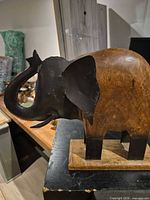 Front angle showing wood body and metal head/trunk