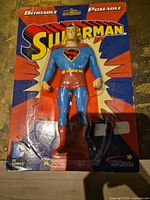 Front view of sealed Superman action figure on card
