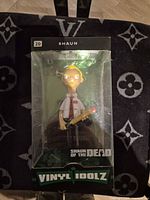 Front view of boxed Vinyl Idolz Shaun figure