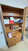 Full view of MDF bookshelf cabinet showing open upper shelves and closed lower cabinet
