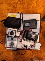 Group shot of all cameras, pouch and Light Tracer light box