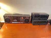 Front view of Sears cassette stereo and two stacked Realistic ChronoSette 256 units on tabletop