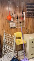 Overall lot showing chair, drying rack, wall-hung utensils, sweeper, dirtbuster