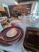 Overview of assorted ceramic, glass and stoneware kitchen items on countertop