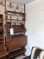 Overall view of teak modular bookcase with lamp attached