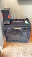 Roland KC-500 amplifier with Yamaha MS20S speaker on top