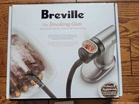 Retail box front displaying Breville Smoking Gun image and branding