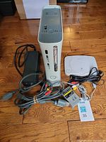 Xbox 360 console, PSone console, power brick, AV cables overview