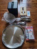 Group view of all items: monbento lunchbox, butter dish, two strainers, whisk, round pan, fridge fresh