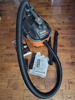 Vacuum with hose, wands, nozzle, filter, dust bags and manual displayed