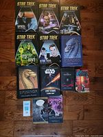 All twelve books laid out showing covers