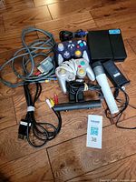 Entire lot showing controllers, microphone, cables, PS VR processor, camera, power adapter