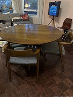 Full dining set showing round table and four chairs