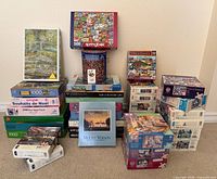 Overall lot showing 35 assorted puzzle boxes and tin