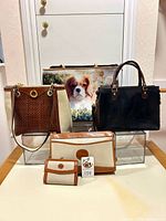Group view of 3 bags, wallet and coin purse